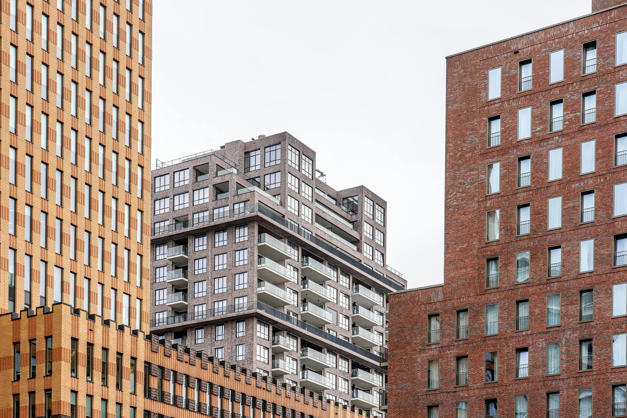 Contemporary high-rise buildings displaying urban architectural design with varied textures and materials.